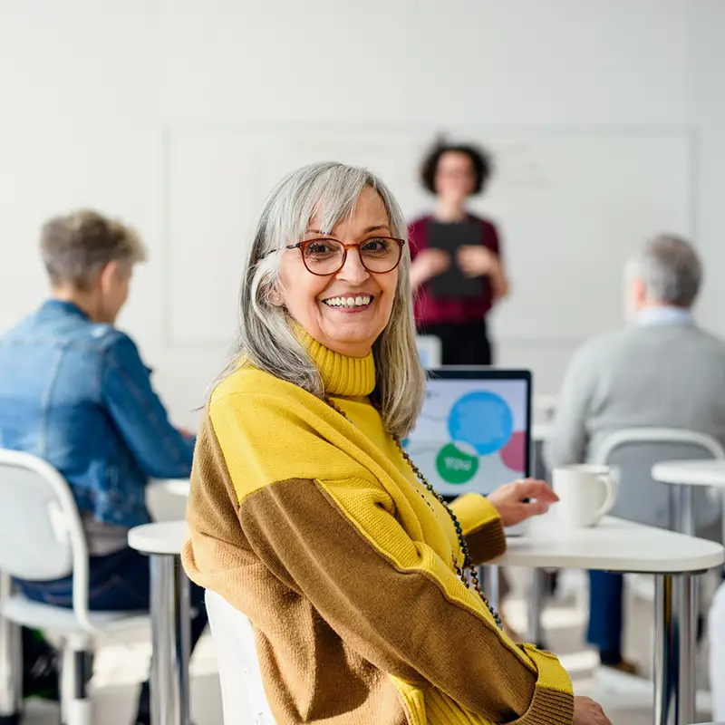 3rd decade financial workshops senior attending computer class